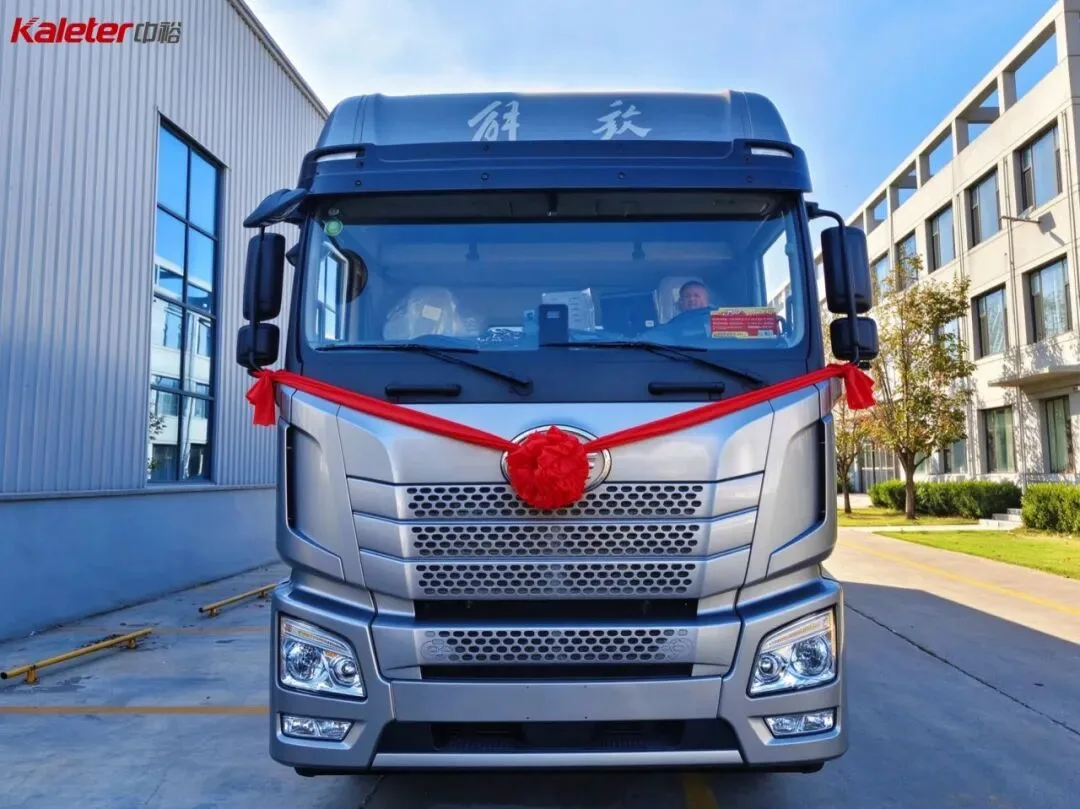 Front of the new day-old chick transport truck with a red ribbon for the handover
