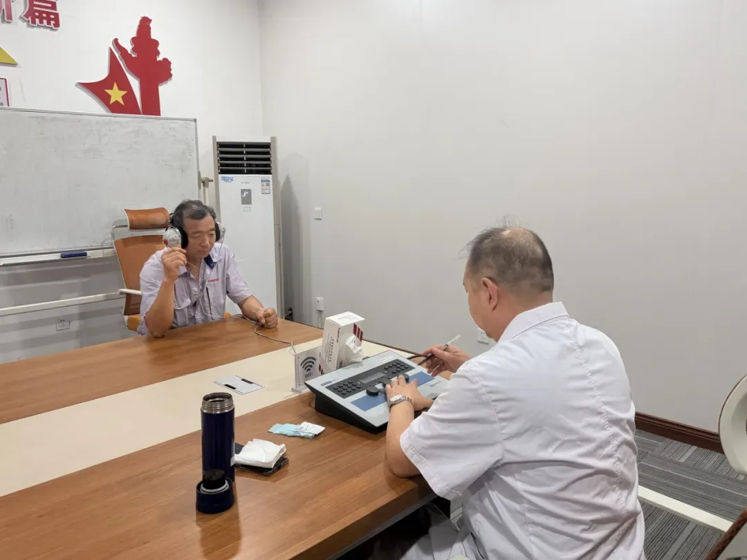 A Kaleter employee undergoing a hearing test during the on-site checkup
