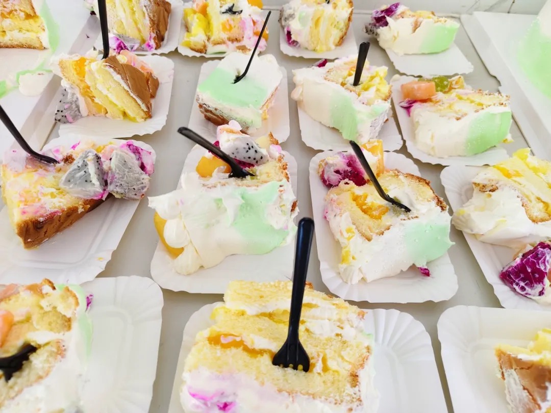 Cake slices set out for colleagues at Kaleter's July birthday celebration