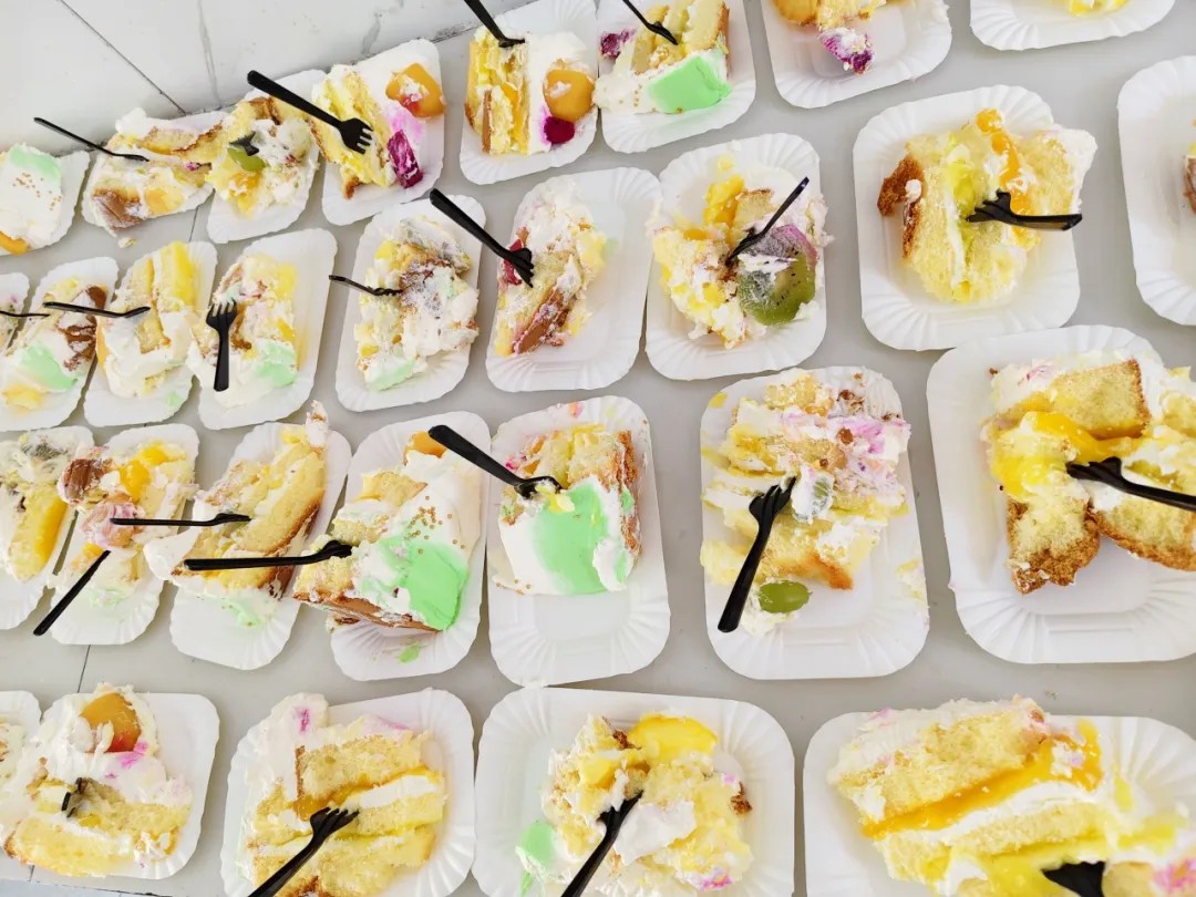 Assorted cake slices laid out for Kaleter's June birthday celebration