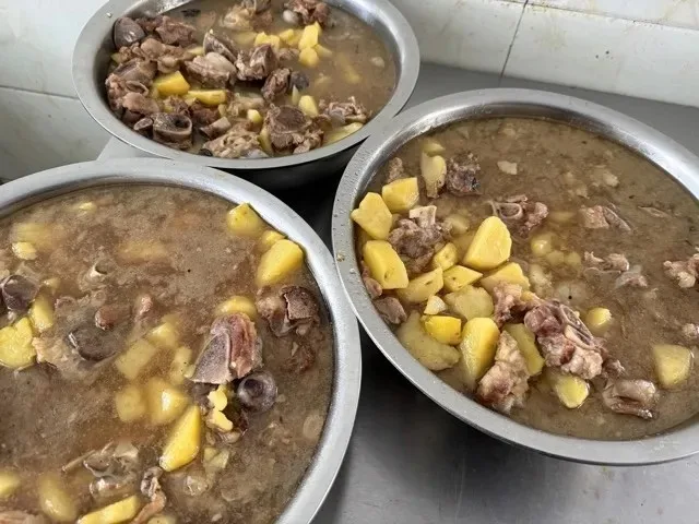 Bowls of braised chicken and potato stew prepared for Kaleter's June birthday celebration