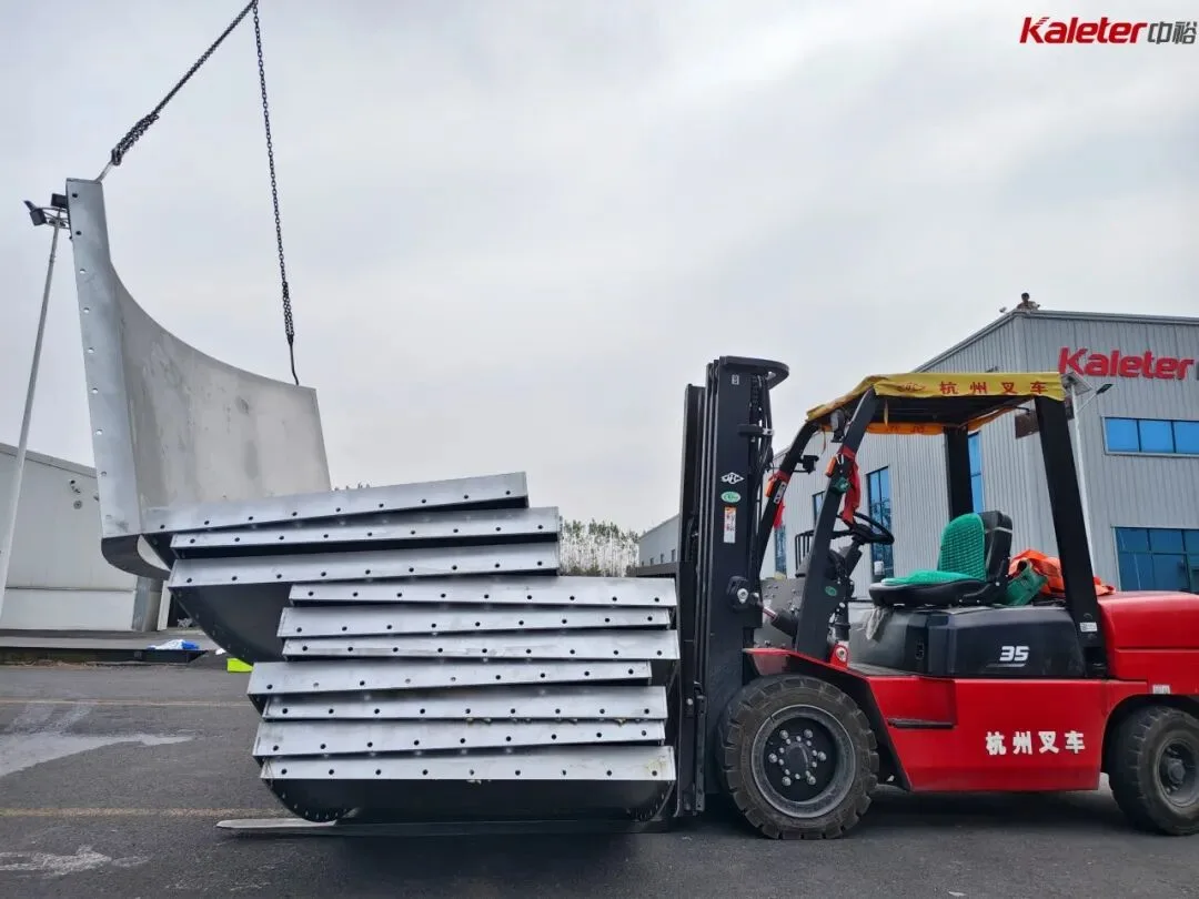 Forklift moving stacked fermentation tank panels at the factory