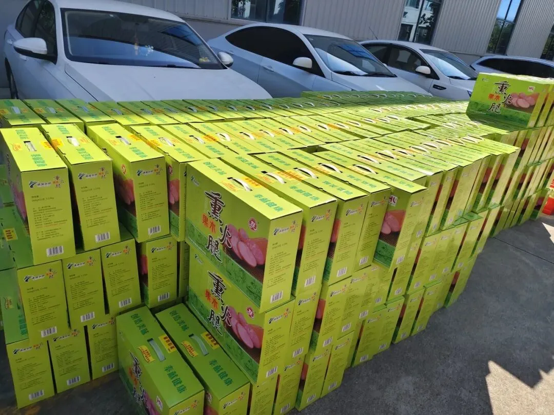 Stacks of green fruit gift boxes ready for the handout