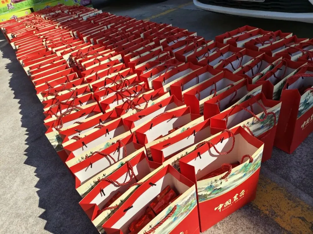 Red Mid-Autumn Festival gift bags laid out in rows