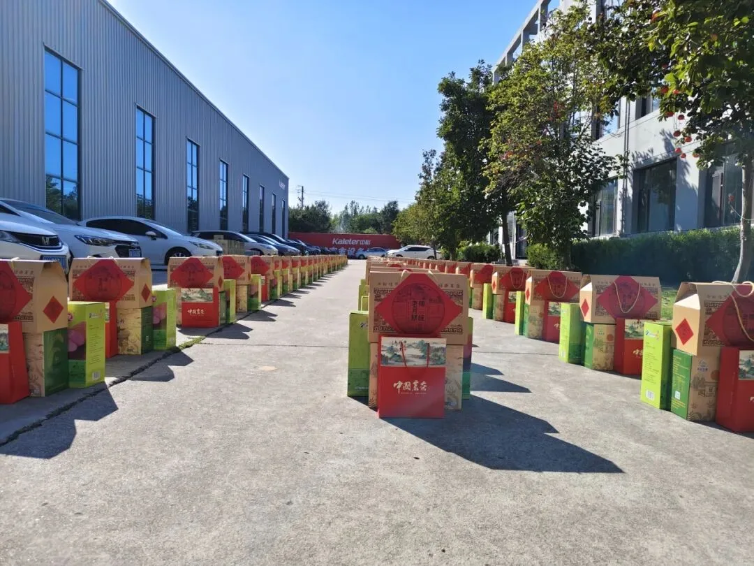 Gift sets for each employee lined up along the road outside the office