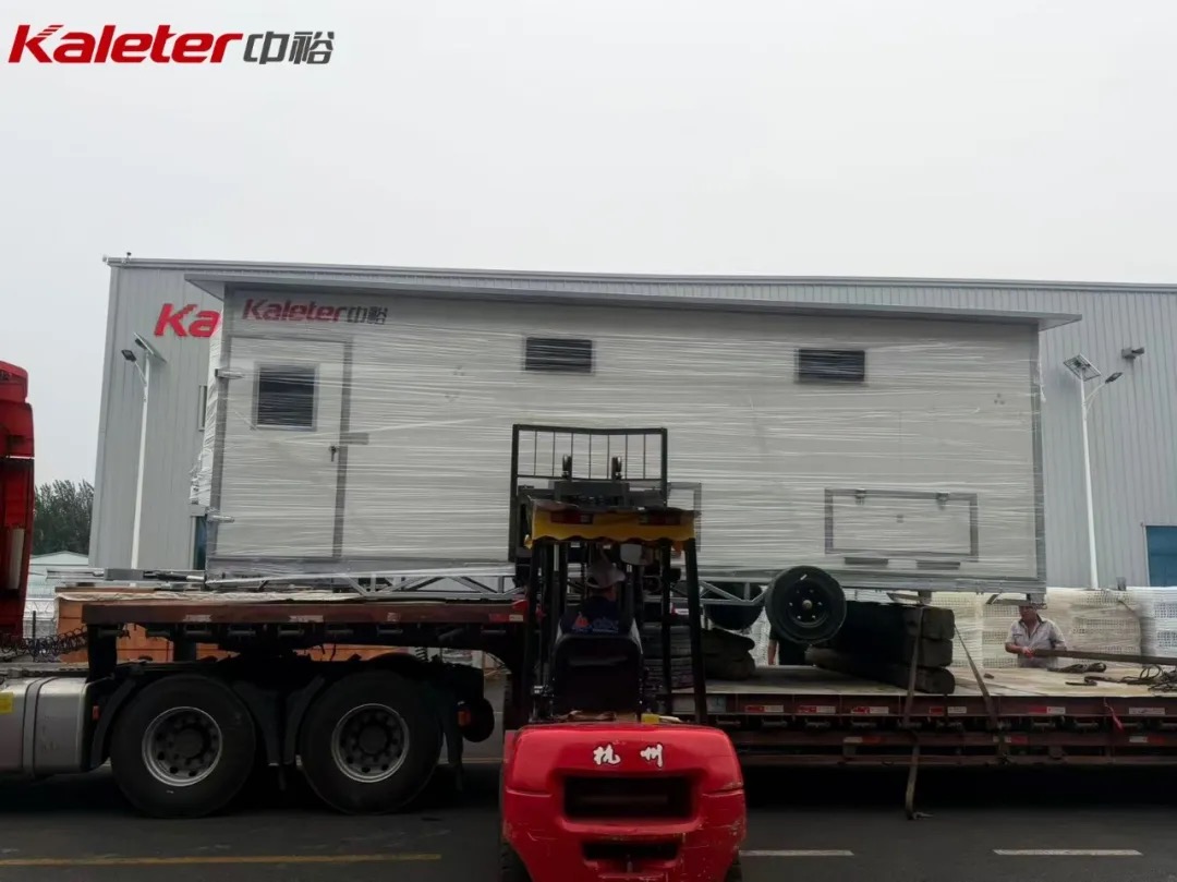 Kaleter mobile chicken house being loaded for shipment with a forklift