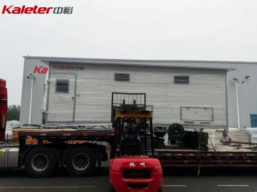 Kaleter mobile chicken house being loaded for shipment with a forklift