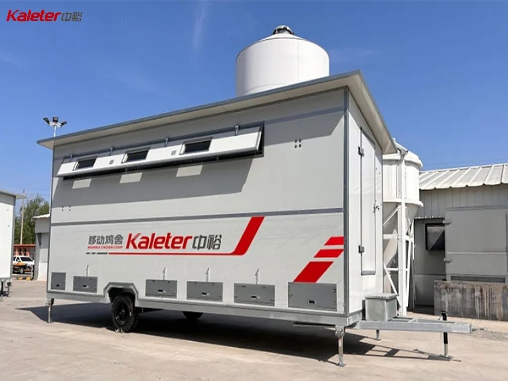 Large Kaleter mobile chicken house on a trailer chassis with an external feed silo