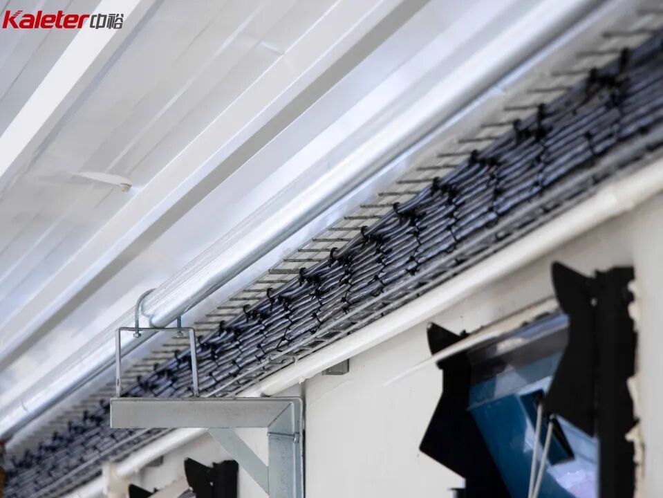 Cable tray carried on brackets past the inlet vents