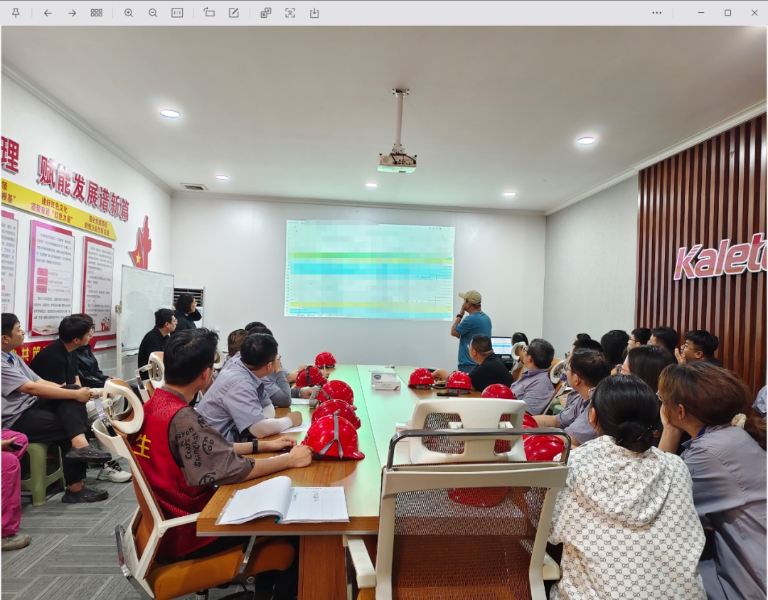 Training session in progress with a presentation slide on screen