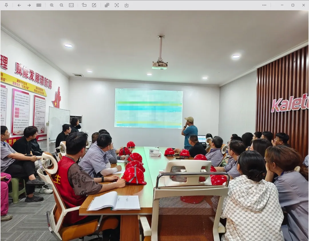 Training session in progress with a presentation slide on screen