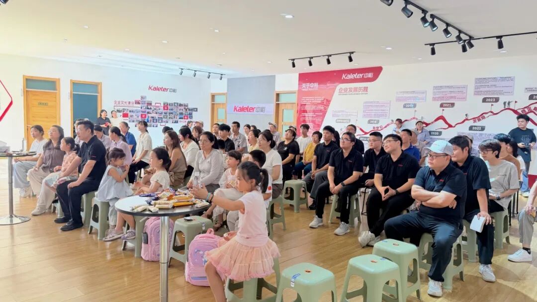 Employees and their families seated for the start of the Kaleter student support event