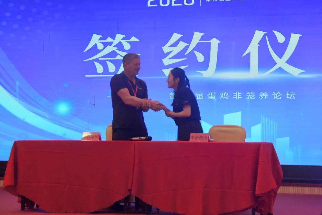 Kaleter and Hotraco Agri representatives shaking hands at the signing ceremony