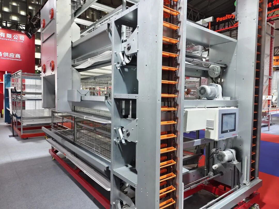 Kaleter layer cage system on display, showing the frame, egg belt and drive units