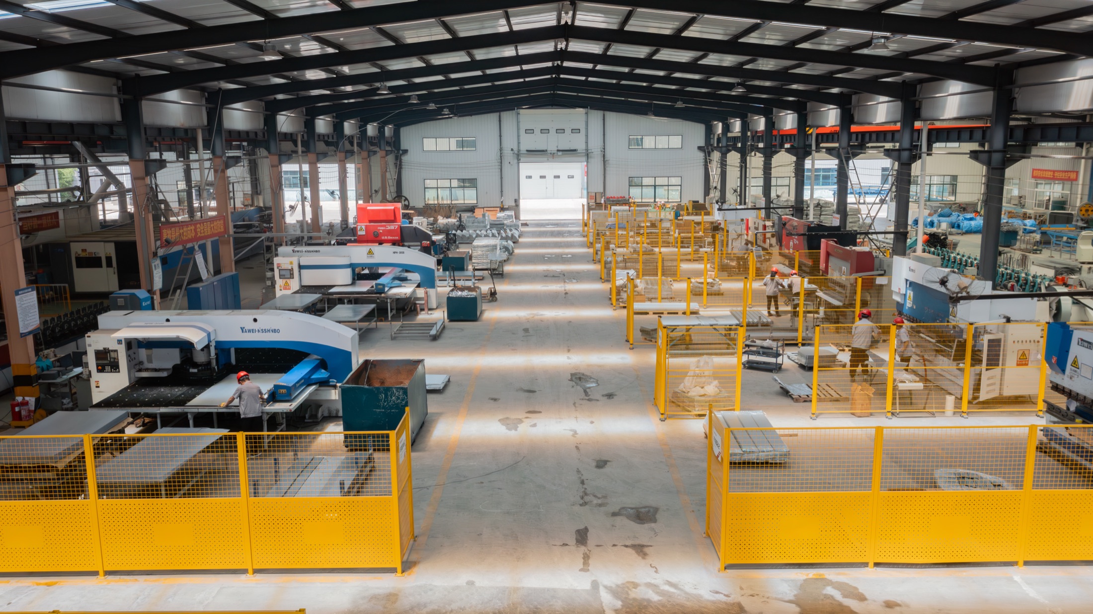 Sheet metal fabrication floor at the Kaleter plant, with CNC punching machines and press brakes in operation