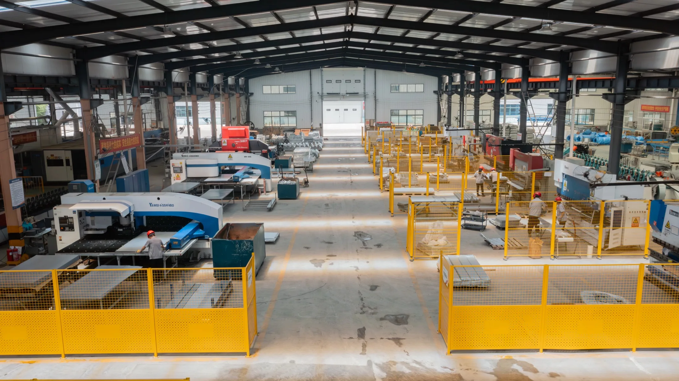 Sheet metal fabrication floor at the Kaleter plant, with CNC punching machines and press brakes in operation